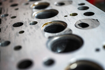 Close-up of a disassembled engine, parts of a car automatic transmission box on a car in a garage or repair shop station for repair or maintenance. Detail. Close-up view