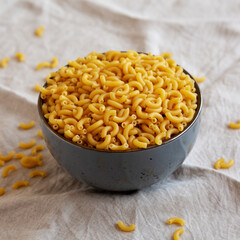 Bowl of Dry Organic Macaroni Elbow Pasta, Ready to be Cooked