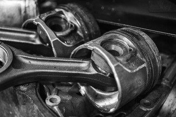 Close-up of a disassembled engine, parts of a car automatic transmission box on a car in a garage...