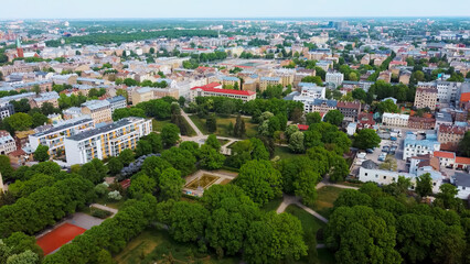 Riga Cityscape Spring Aerial Top View , Town, Latvia. Sunny Day Building Rooftops. Riga Skyline, Latvia, City Center, Teika, Purvciems in the Background. Architecture of the Downtown.