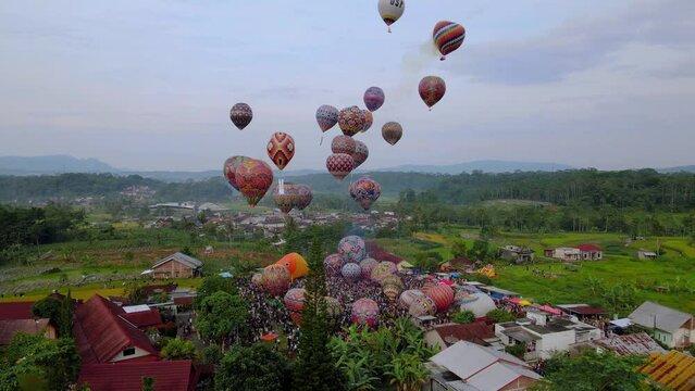 Hot air balloons take off for the Wonosobo hot air balloon festival in central Java, Indonesia.