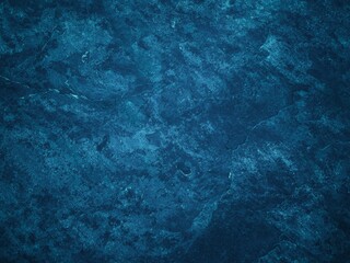 Beautiful abstract dark blue navy stucco wall background.,textured with space for text.,blue background