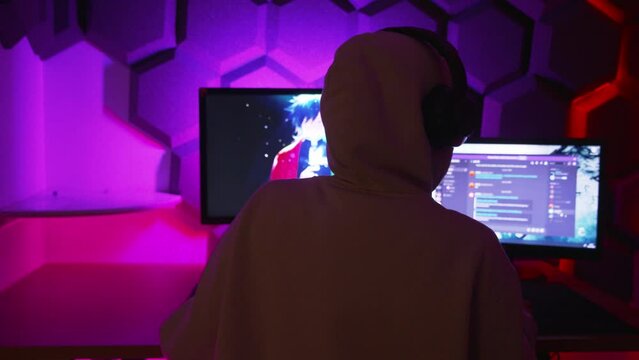 PC Gamer putting on headset and loading a game