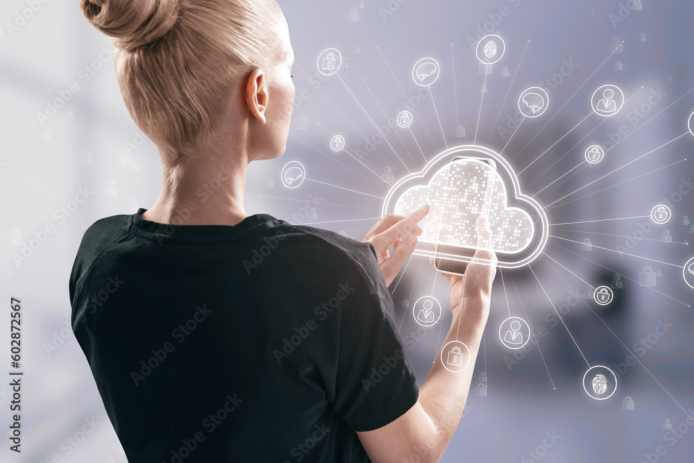 Poster back view of young blonde woman using cellphone with digital white cloud hologram and various icons 