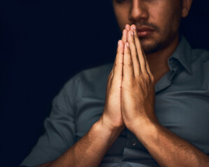 Fototapeta Praying, worship and hope with hands of man for religion, spirituality and faith. Focus, thinking and peace with closeup of person and mockup space on dark background for belief, prayer and gratitude obraz