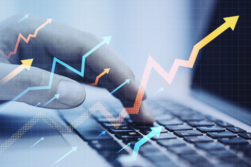 Close up of male hand using laptop keyboard with growing arrows on blurry background. Growth,...