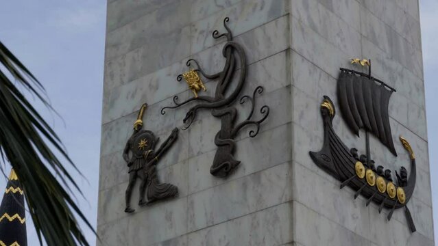 Batumi, Georgia &ndash; May 6, 2023: Column decorations of Statue of Medea erected in Batumi, Georgia. Fragments from the myth that tells about the journey of the Argonauts for the Golden Fleece.