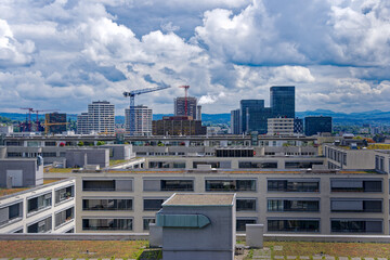 Skyline of City of Z&uuml;rich district Oerlikon on a blue cloudy spring day. Photo taken May 12th, 2023, Zurich, Switzerland.