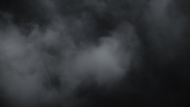 Immersive mesmerising spooky Halloween smoke cloud VFX insert element in 4k slow-motion: a captivating, ethereal swirling, mysterious atmosphere, cloudy mist fog. 
