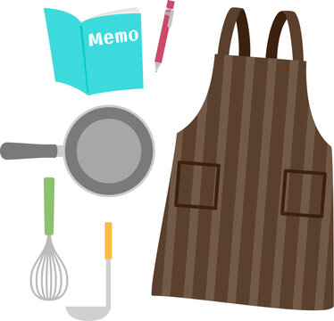 エプロンとメモ帳と調理器具、料理教室