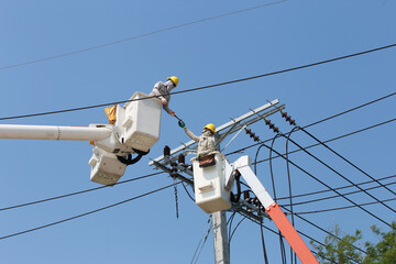 electrician working on a power pole