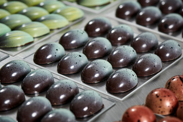 Beautiful confectioner's chocolate eggs in different colors