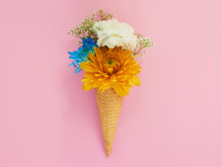 Flowers, cone and ice cream in a studio for decoration, creativity or art with fresh and colorful...