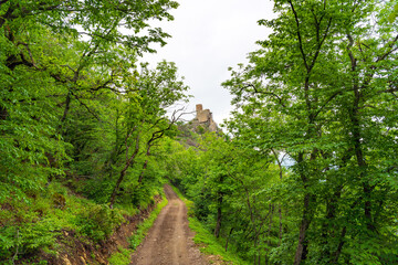 Fototapeta na wymiar Dirt road to the ancient Chirag Gala tower in Azerbaijan