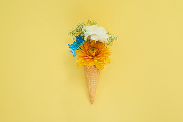 Floral ice cream in a cone in a studio for art, creativity or decoration with fresh and colorful...