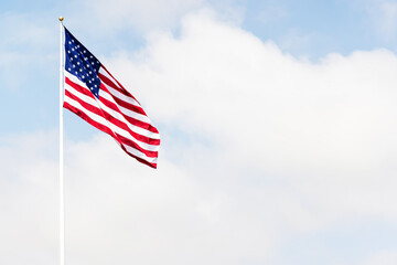 A photo of American flag against the sky