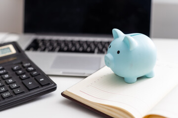 Piggy Bank With Laptop which means make money online or internet business concepts