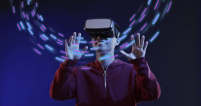 Animation of glowing light trails of data transfer and asian man in vr headset