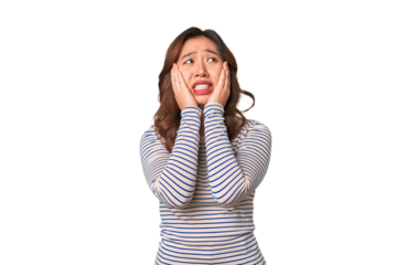 A young chinese woman whining and crying disconsolately.