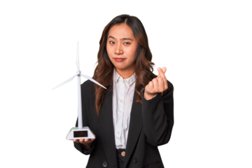 A young Chinese businesswoman proudly holds a windmill, symbolizing her commitment to renewable energy and sustainable development.