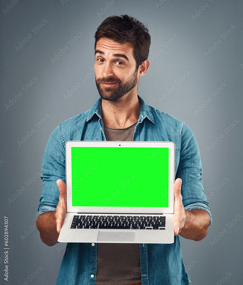 Poster man, laptop and portrait with mockup green screen for advertising or marketing against a grey studio