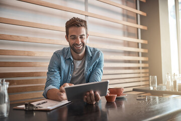 Smile, internet and a man with a tablet at a cafe for communication, connectivity and...