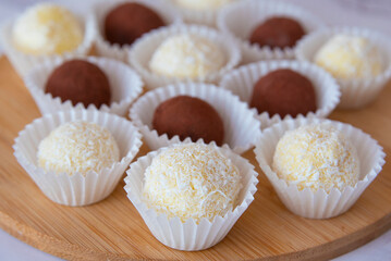 Chocolate and coconut candies. Truffles. macro photography. Abstract background.