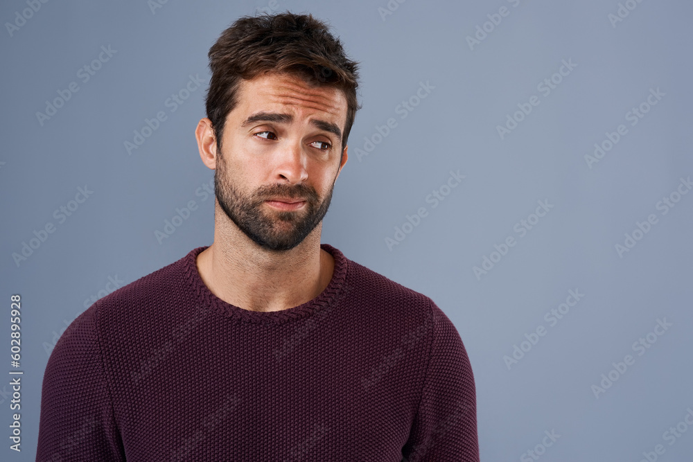 Poster doubt, thinking and face of man with unsure, uncertain and thoughtful on gray background in studio. 