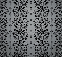 Obraz premium Wallpaper in the style of Baroque. Seamless vector background. Black and gray floral ornament. Graphic pattern for fabric, wallpaper, packaging. Ornate Damask flower ornament