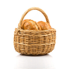 bread in wicker basket isolated on white