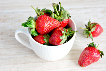 A cup of strawberries isolated, close up