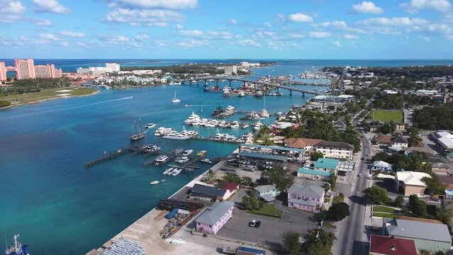 Beautiful cinematic aerial view of the Bahamas - Nassau city - cruise ship port, luxury hotels, buildings, and turquoise water oceans