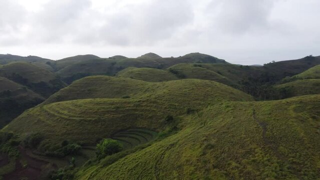 Aerial, Teletubbies Hills of Nusa Penida Island Used by Locals as Farming Terraces.
Abundant farmland rolling hills and a tourist Attraction in Bali - Indonesia