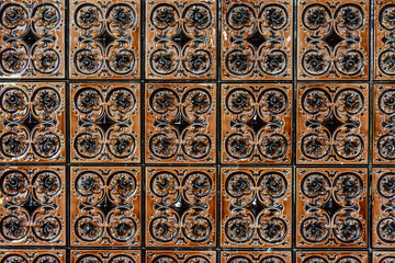 Old vintage ceramic tiles for the decoration stoves and fireplaces. Background, texture
