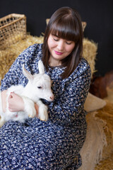 Woman pretty woman white goat countryside farm Friendship lifestyle