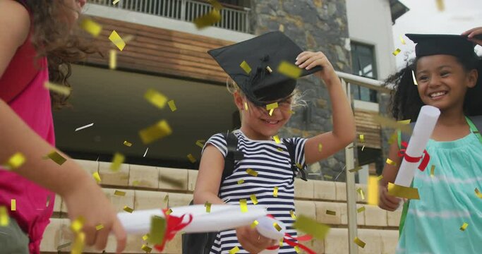 Animation of gold confetti over celebrating diverse schoolgirls with mortar boards and diplomas