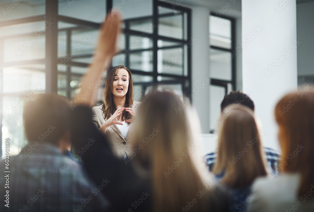 Aufkleber woman speaker at seminar, audience with hands up for questions and answers at training presentation 