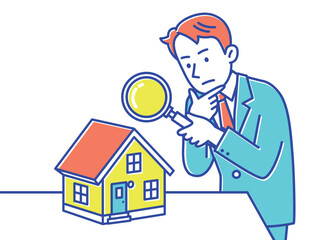 何か問題がないかどうか虫眼鏡を持って家をチェックする男性
