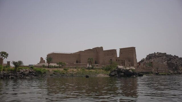 Philae temple from the boat in a beautiful sunny day in Aswan, Egypt