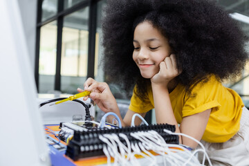 Children girl with afro hairstyle education electronic on table at class room.  learning innovation...