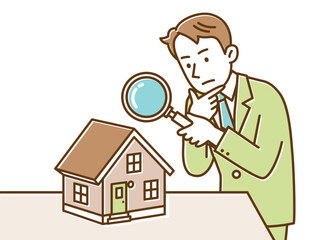 何か問題がないかどうか虫眼鏡を持って家をチェックする男性