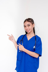 Portrait of a young and skilled medical student, nurse, intern posing and pointing to the right side with both hands. Isolated on a white background.