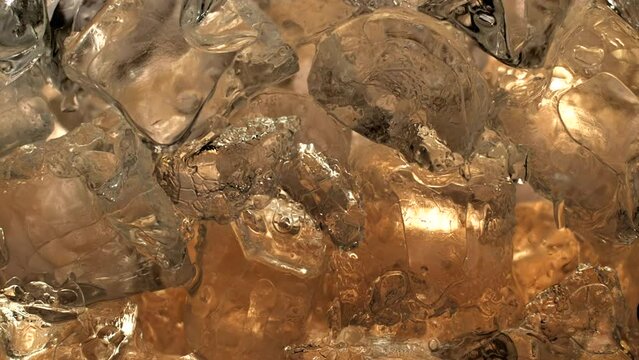 Immersive 4k Slo-motion footage of the summer drink delight. Chilled, fizzy elixir on ice. Tantalising swirls to quench your thirst with this refreshing cola, juice or cider.