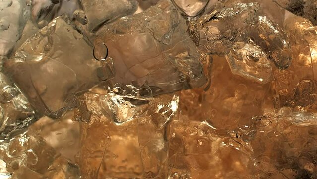 Immersive 4k Slo-motion footage of the summer drink delight. Chilled, fizzy elixir on ice. Tantalising swirls to quench your thirst with this refreshing cola, juice or cider.