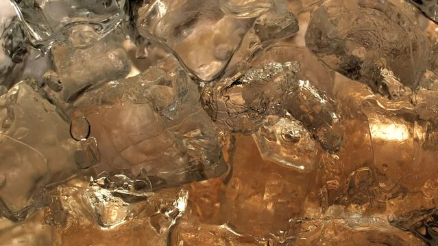 Immersive 4k Slo-motion footage of the summer drink delight. Chilled, fizzy elixir on ice. Tantalising swirls to quench your thirst with this refreshing cola, juice or cider.
