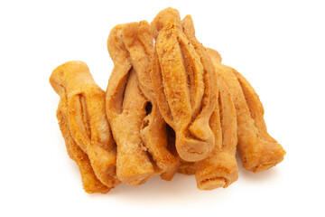 Bunch of salted Masala crispy and crunchy Karela Mathri or Matthi. Isolated on white background.
