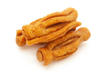 Three pieces of salted Masala crispy and crunchy Karela Mathri or Matthi. Isolated on white background.