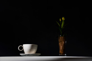 White ceramic coffee cup on table on black background, Coffee Shop