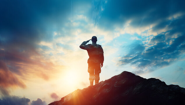 silhouette of a soldier saluting in the sunset