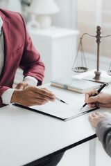 law concept The legal officer listening to the law report of booster and adjusting the agreement paper by writing it down.